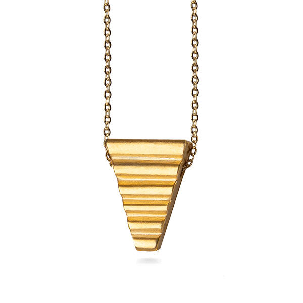 Gold triangular pendant necklace on a white background