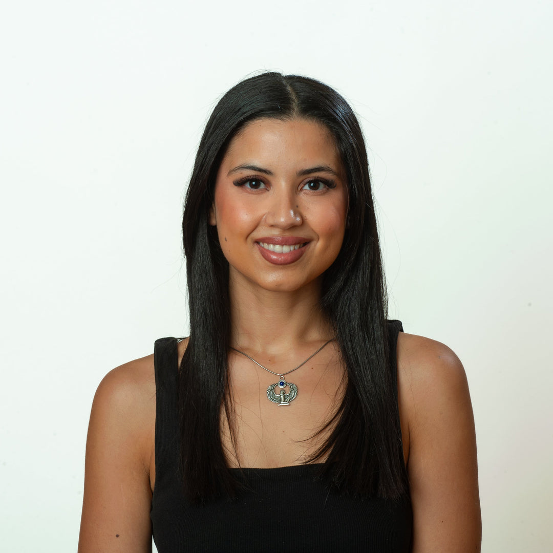 Woman wearing a black top against a white background