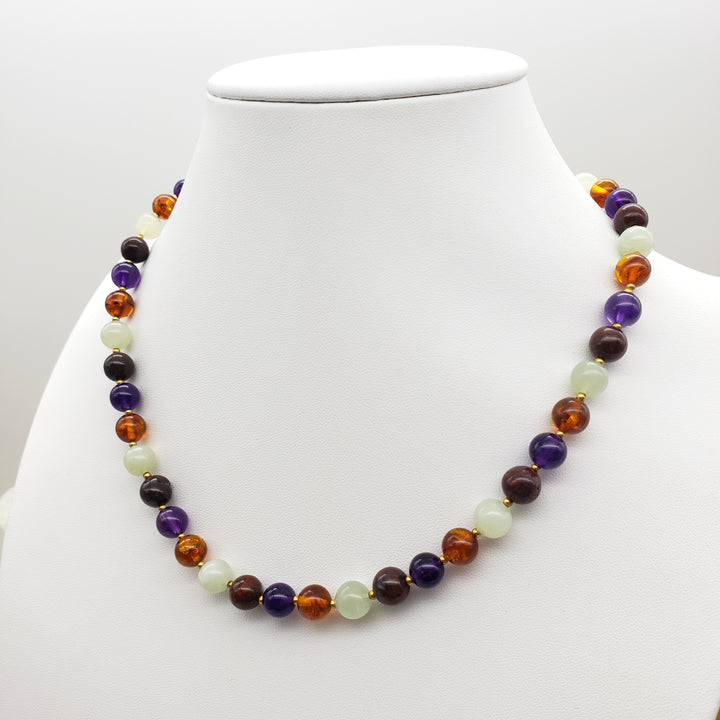 Multicolored beaded necklace on a white mannequin bust