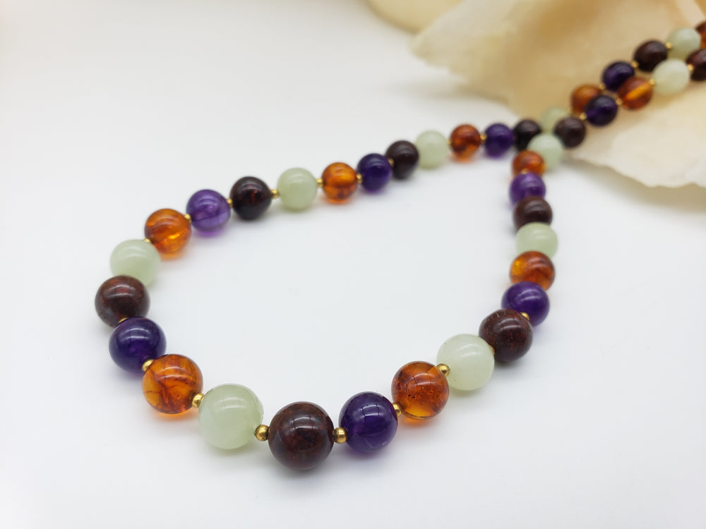 Multicolored beaded necklace on a white background