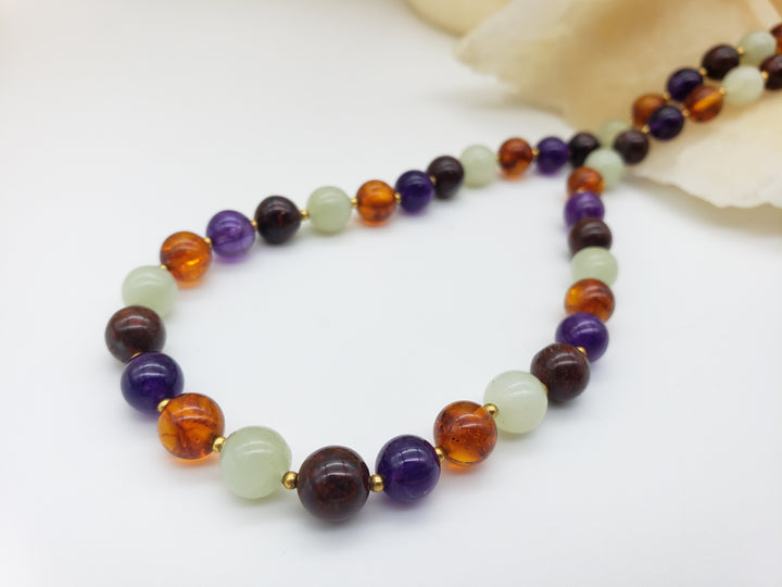 Multicolored beaded necklace on a white background