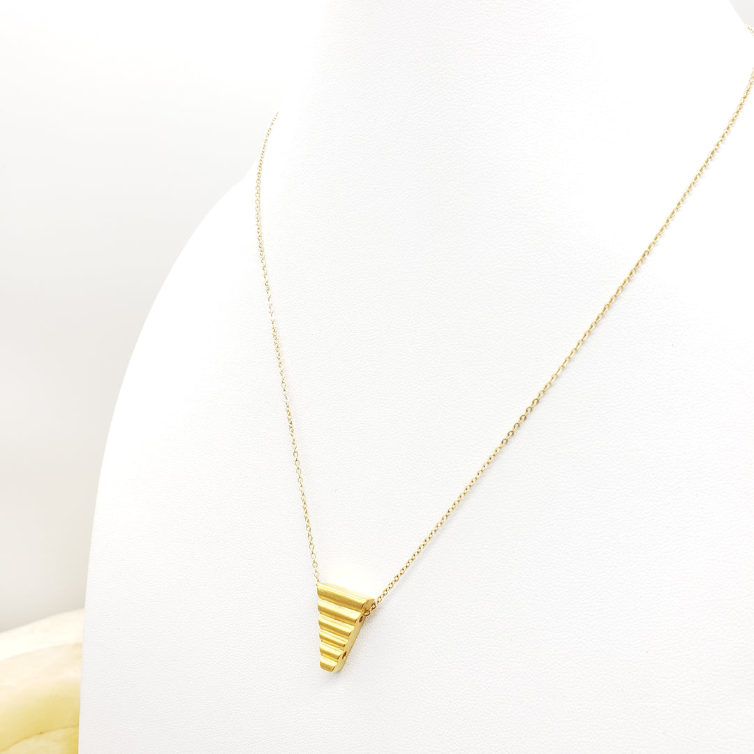 Gold necklace on a white background