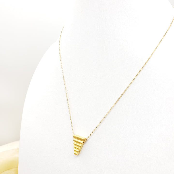 Gold necklace on a white background