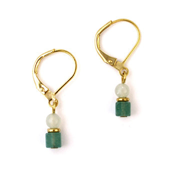 Gold earrings with green beads on a white background