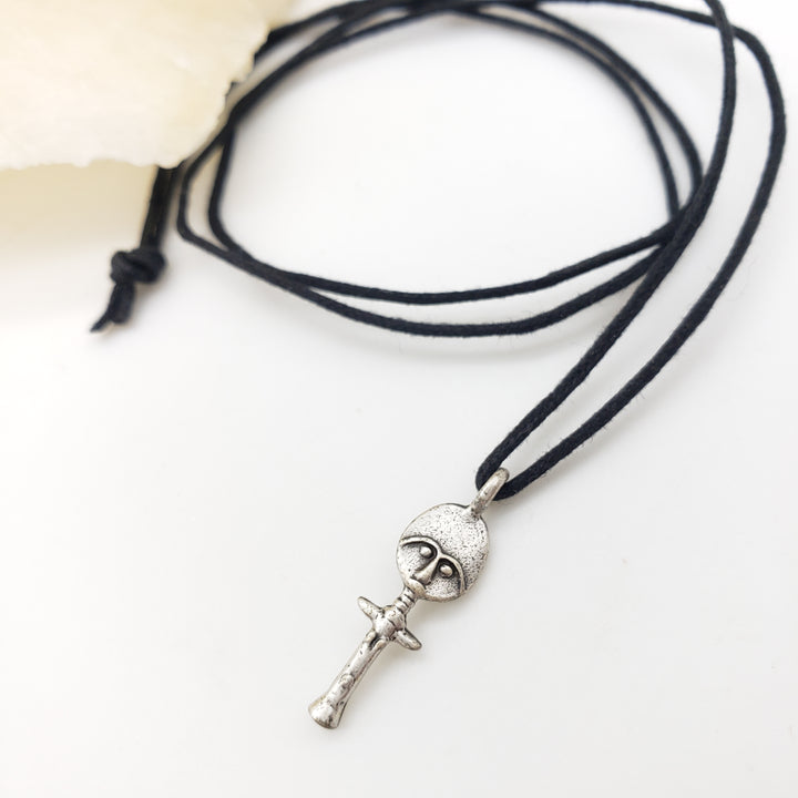 Necklace with a silver pendant on a white background