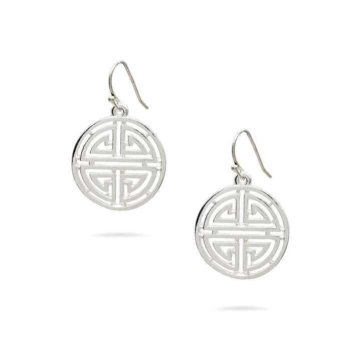 Pair of silver earrings with intricate circular design on a white background