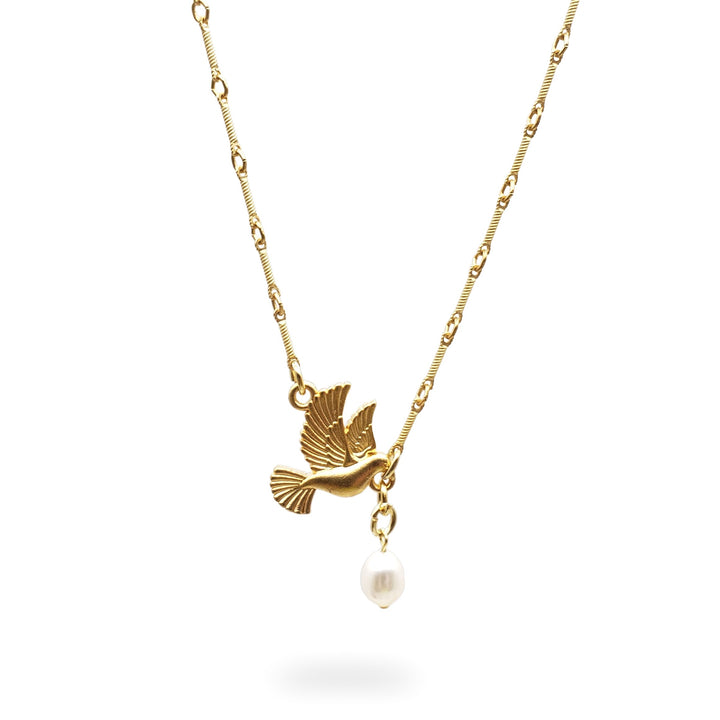 A delicate gold chain necklace featuring a small gold bird pendant and a dangling white pearl, shown against a plain white background.