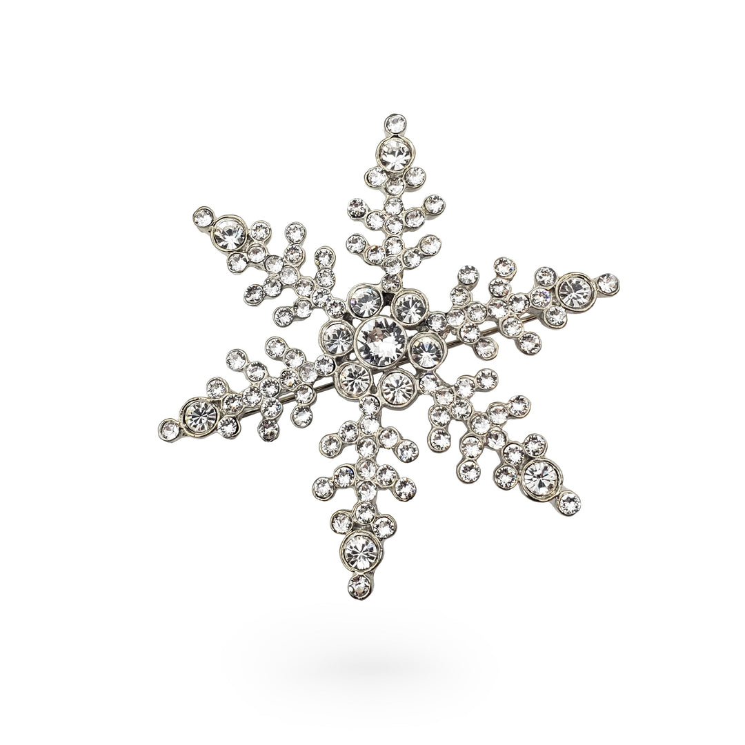 Decorative snowflake with rhinestones on a white background