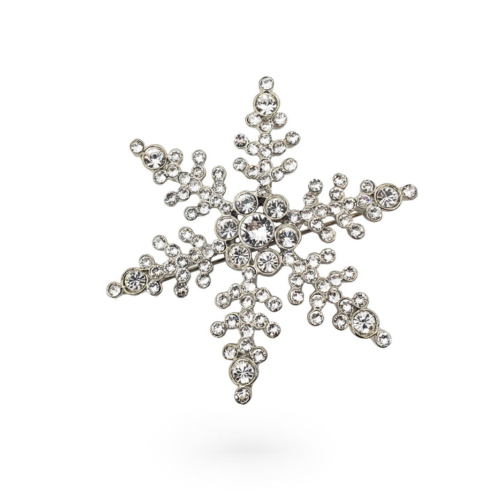 Decorative snowflake with rhinestones on a white background